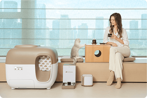 cat & owner resting next to the litter box